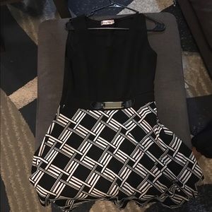 black & white Asymmetric dress w/metal bow accent.